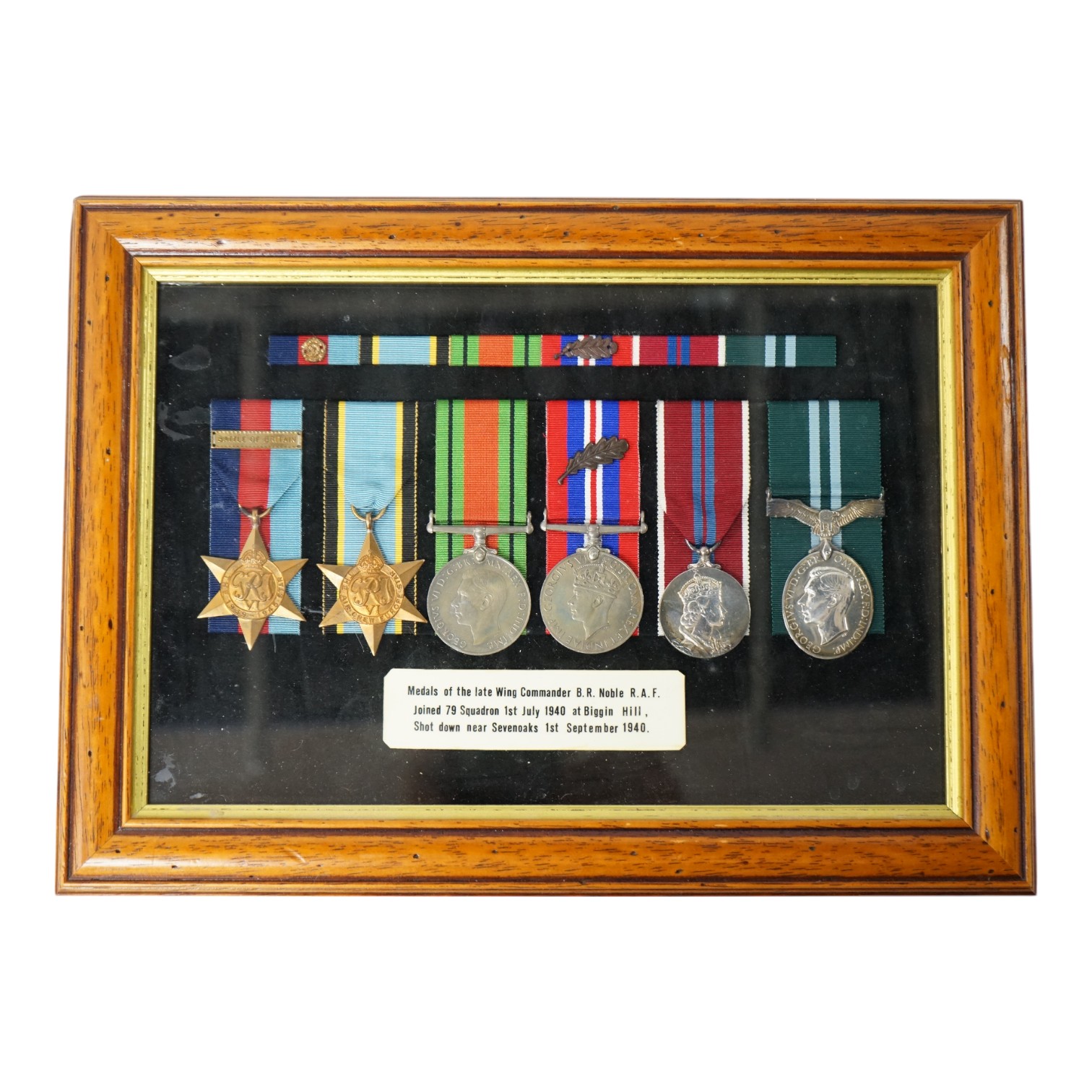 A framed WWII RAF medal group awarded to Wing Commander Brian Robert Noble, comprising;, The 1939-1945 Star, with clasp for the Battle of Britain, The Air Crew Europe Star, The Defence Medal, The British War Medal, The 1